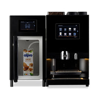 BUB Espresso S Melk koffieautomaat met geopende melkkoeler en pak amandeldrink aan de melkslang